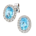 Swiss Blue Topaz and Diamond Oval Halo Stud Earrings in 9ct White Gold