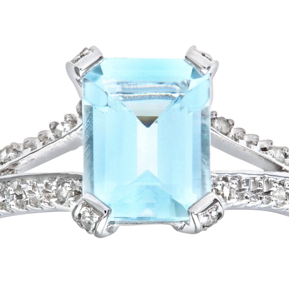 9ct White Gold Emerald Cut Aquamarine Ring With 0.07ct Diamond Shoulders