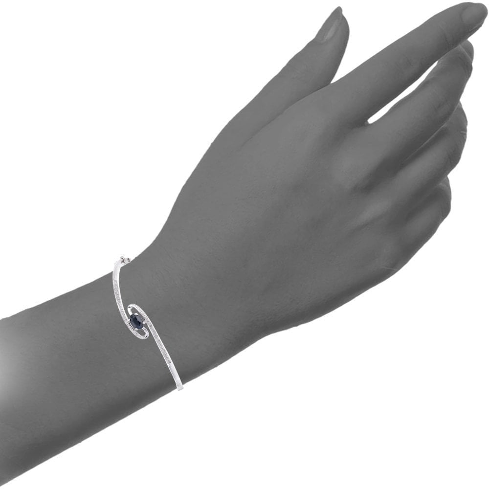 Oval Solitaire Natural Black Sapphire and Diamond Swirl Bangle in 9ct White Gold