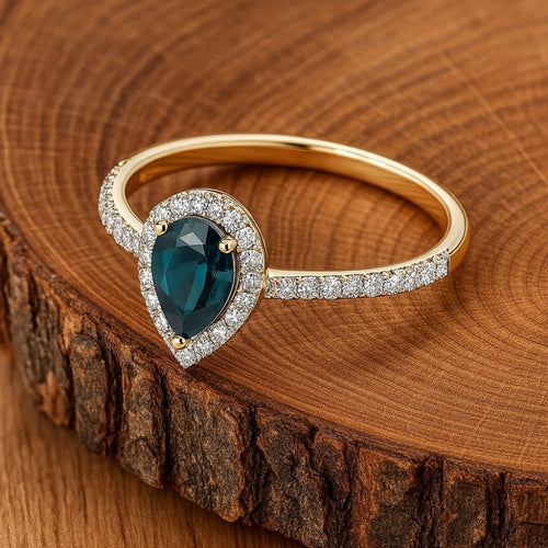 0.6 Ct Pear Natural Blue Sapphire and Diamond Solitaire Halo Ring in 18ct Yellow Gold