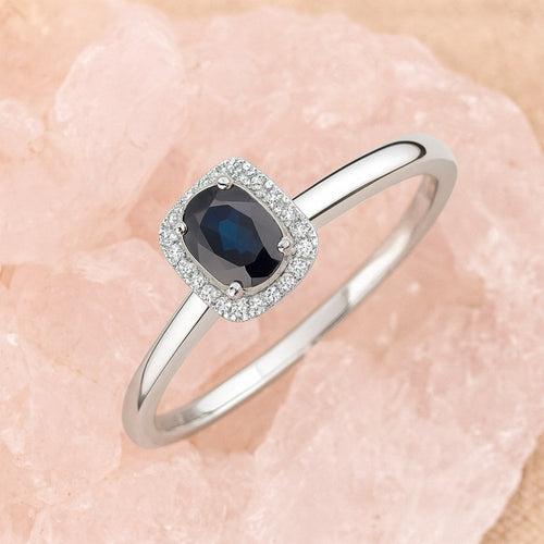 0.58 Ct Oval Natural Blue Sapphire and Diamond Solitaire Halo Ring in 9ct White Gold
