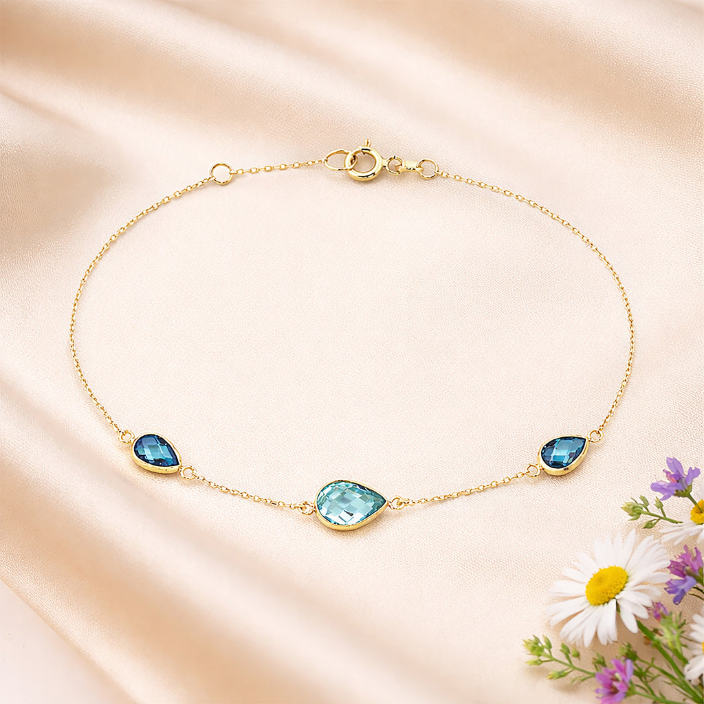 9ct Yellow Gold Blue Pear Cut Cubic Zirconia Trilogy Station Bracelet