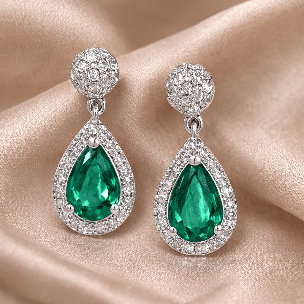 18ct White Gold 0.65ct Pear Emerald and 0.20ct Diamond Teardrop Earrings