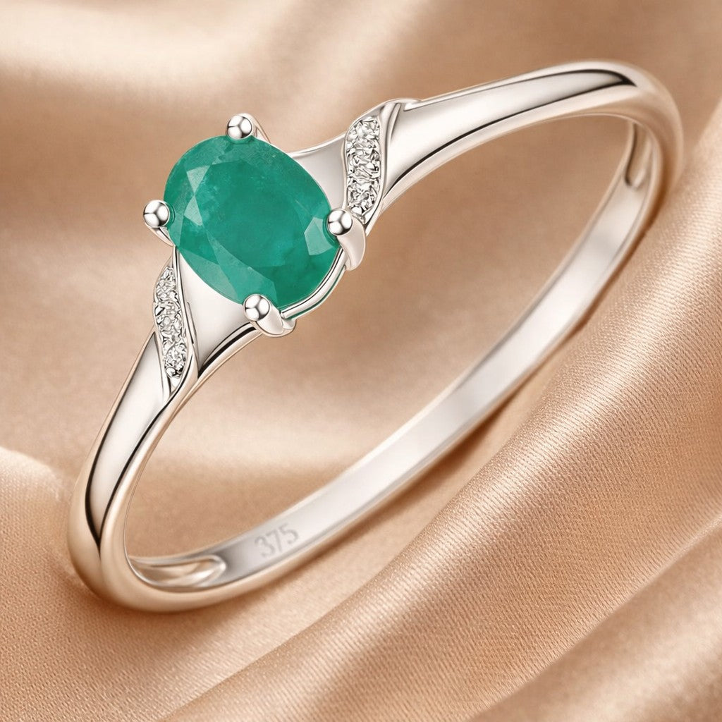 9ct White Gold Oval Emerald and 0.02ct Diamond Shoulders Engagement Ring