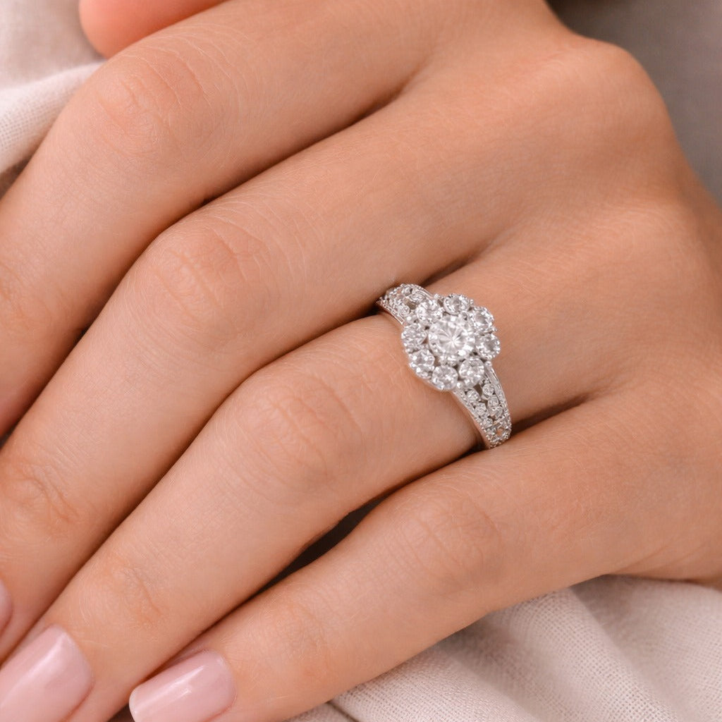 diamond ring on a person's finger with a soft background