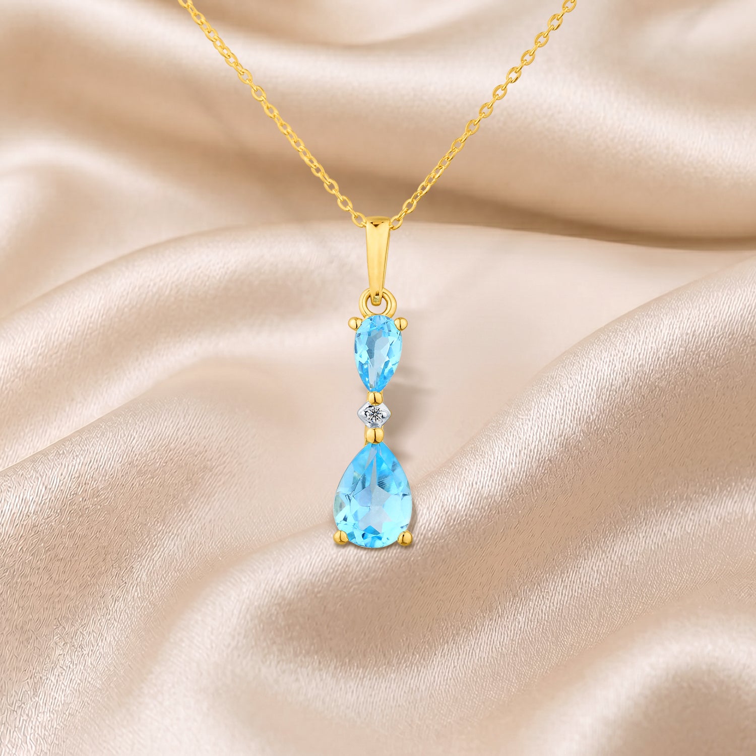 9ct Yellow Gold Pear Blue Topaz and Diamond Pendant