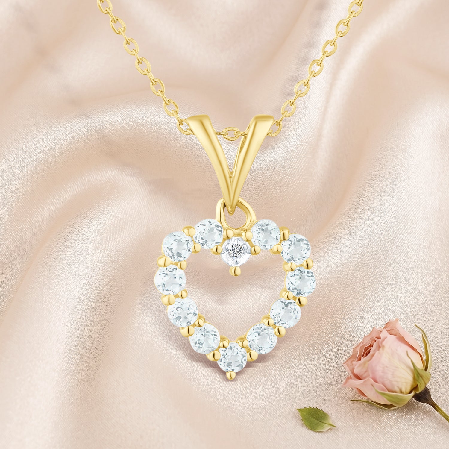 9ct Yellow Gold Blue Topaz and Diamond Open Heart Pendant