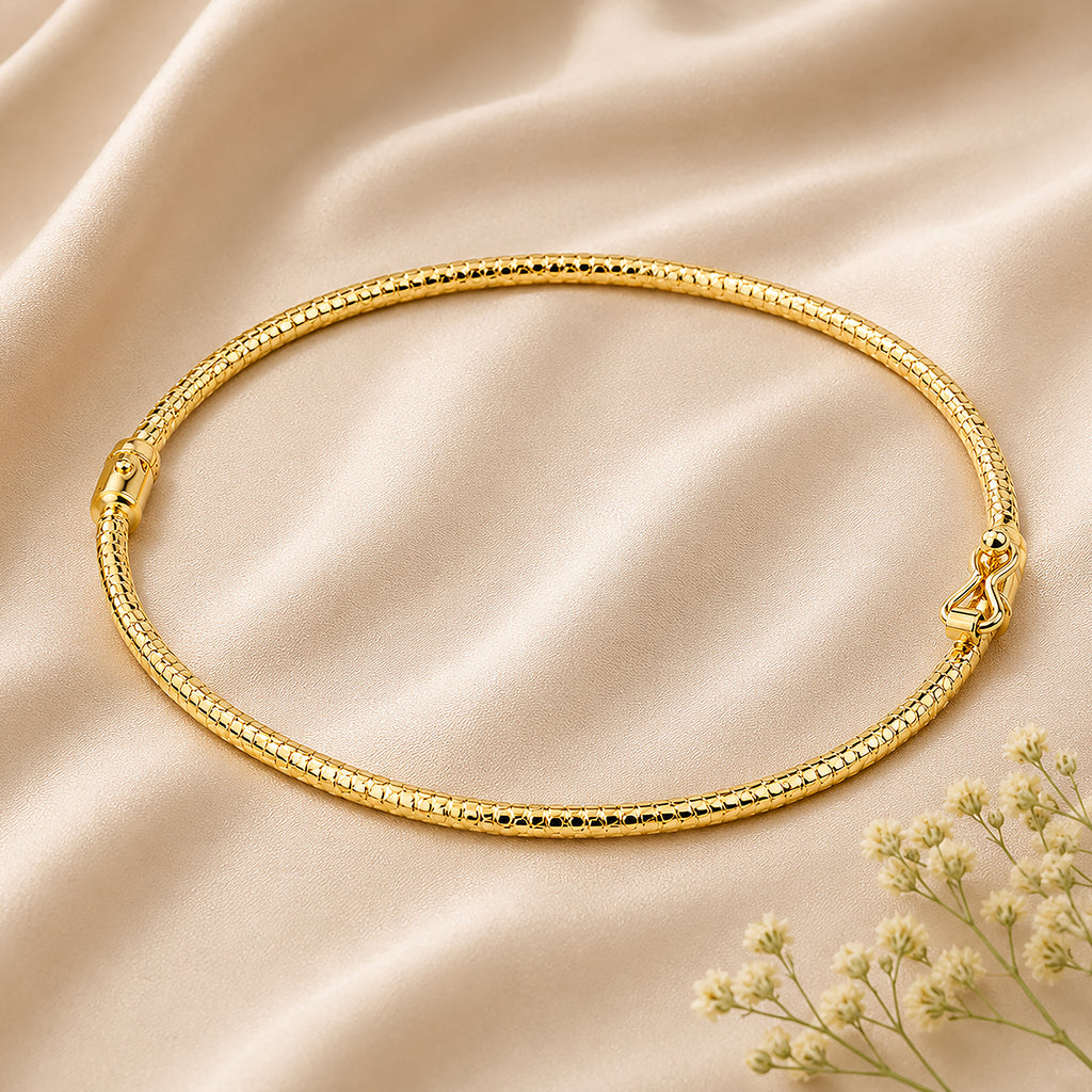 9ct Yellow Gold 6x5cm Diamond Cut Bangle
